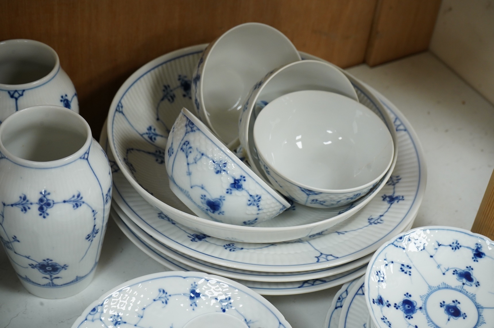 A collection of Royal Copenhagen and Bing & Grondahl onion pattern blue and white tableware